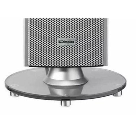 Close-up of silver Dimplex Studio G Tower Heater base with circular glass stand and ventilation grille