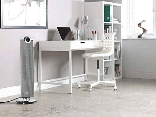 Dimplex Studio G Tower Heater placed on floor in modern home office with white desk and chair