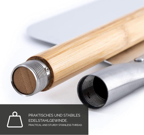 Close-up of wooden handle with stainless steel thread for black pizza stone for oven