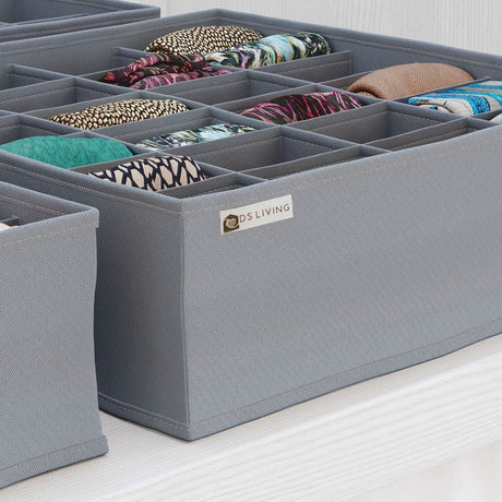 Gray foldable drawer organizer set neatly holding rolled clothes for efficient storage