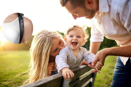 Unisex posture corrector for back pain worn by person with family outdoors on sunny day