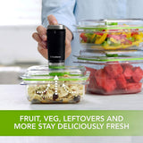 FoodSaver cordless food vacuum sealer preserving freshness in a clear container with fruits and vegetables