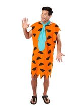 Man wearing an orange Fred Flintstone costume XL with black spots and blue necktie from Kids Fancy Dress