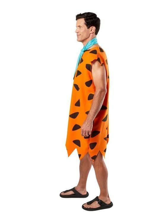 Man wearing Fred Flintstone costume XL with orange spotted tunic and blue necktie from Kids Fancy Dress