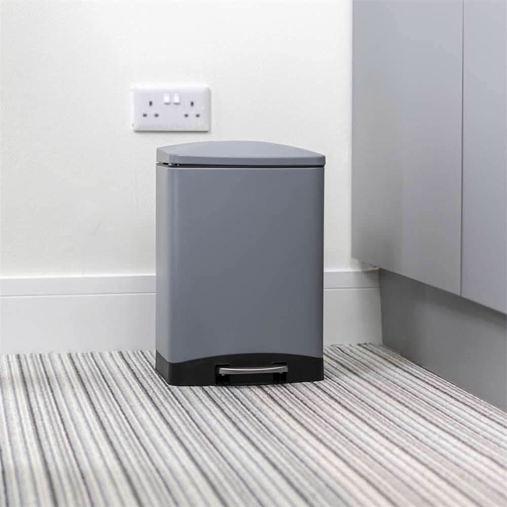 Calitek 6L pedal bin with soft close lid in gray with black base on striped carpet