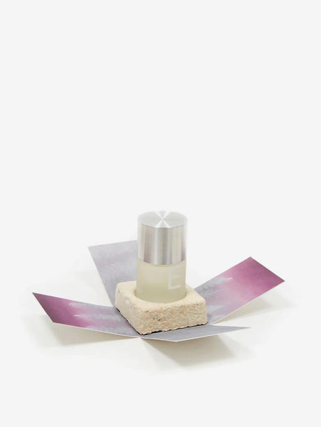 Haeckels Blean 827 E Parfum bottle with silver cap displayed on a stone base and purple folding packaging