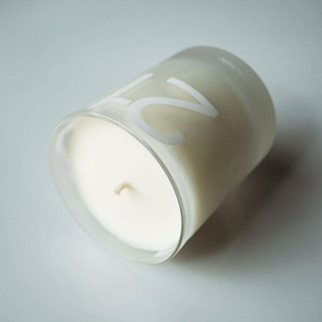 Haeckels Pegwell Candle in a clear glass container for soothing ambiance and decor