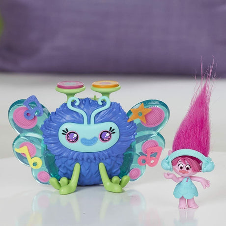 Hasbro Trolls DJ Toy figure with blue fuzzy body and colorful butterfly wings next to pink-haired Troll character