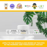 HayMax Original organic allergen barrier balm jar from CLICKK Home Store on white surface with green leaves background