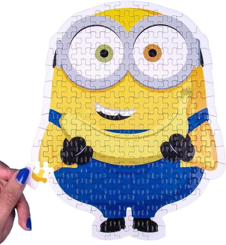 Minions jigsaw puzzle shaped like a yellow Minion character with blue overalls and goggles