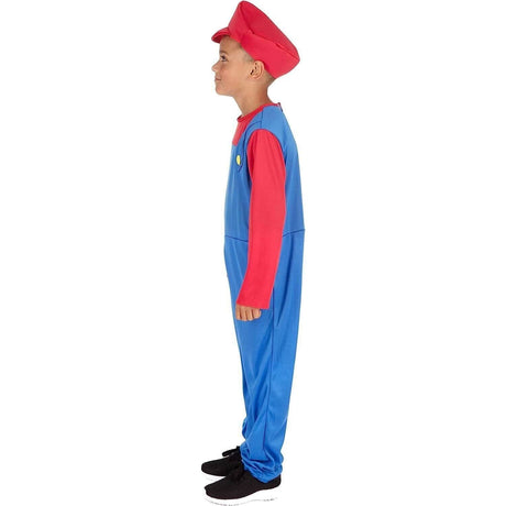 Child wearing Italian plumber costume for kids with red hat and blue overalls standing in profile