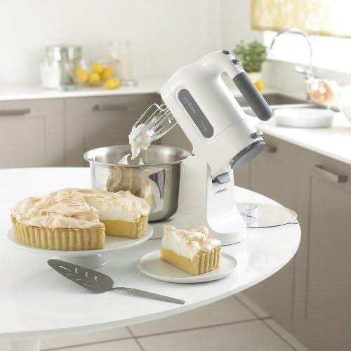 Kenwood Chefette hand mixer in white mixing ingredients beside a pie on a table