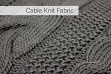 Close-up of cable knit fabric texture on a light grey throw blanket from CLICKK Home Store