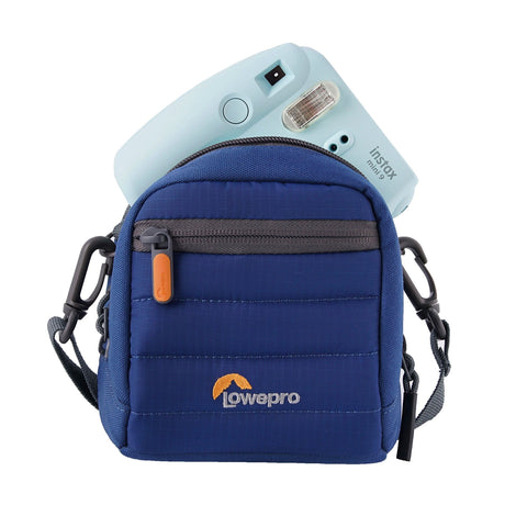 Blue Lowepro Tahoe CS 80 case with front zipper pocket and shoulder strap holding a light blue Instax Mini 9 camera