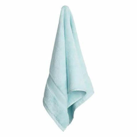 Light blue luxury cotton towel set hanging neatly with soft texture by CLICKK Home Store