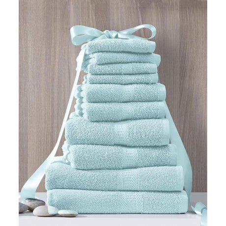 CLICKK Home Store luxury cotton towel set stacked neatly with a light blue ribbon on wooden background