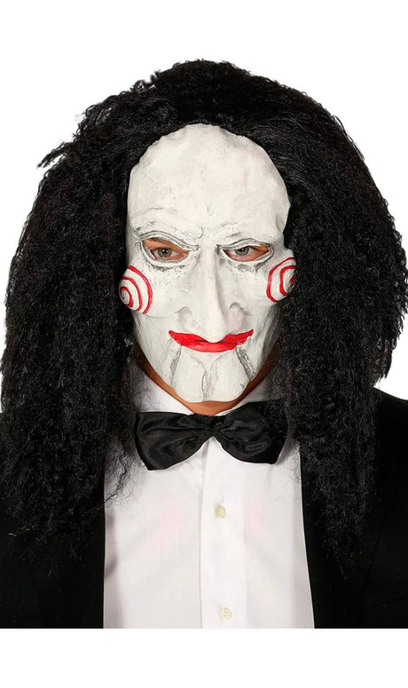 Men wearing a men's jigsaw puppet mask with white face, red spiral cheeks, and curly black hair