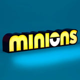 Minions bedroom light with yellow illuminated letters and a single eye design on a blue background