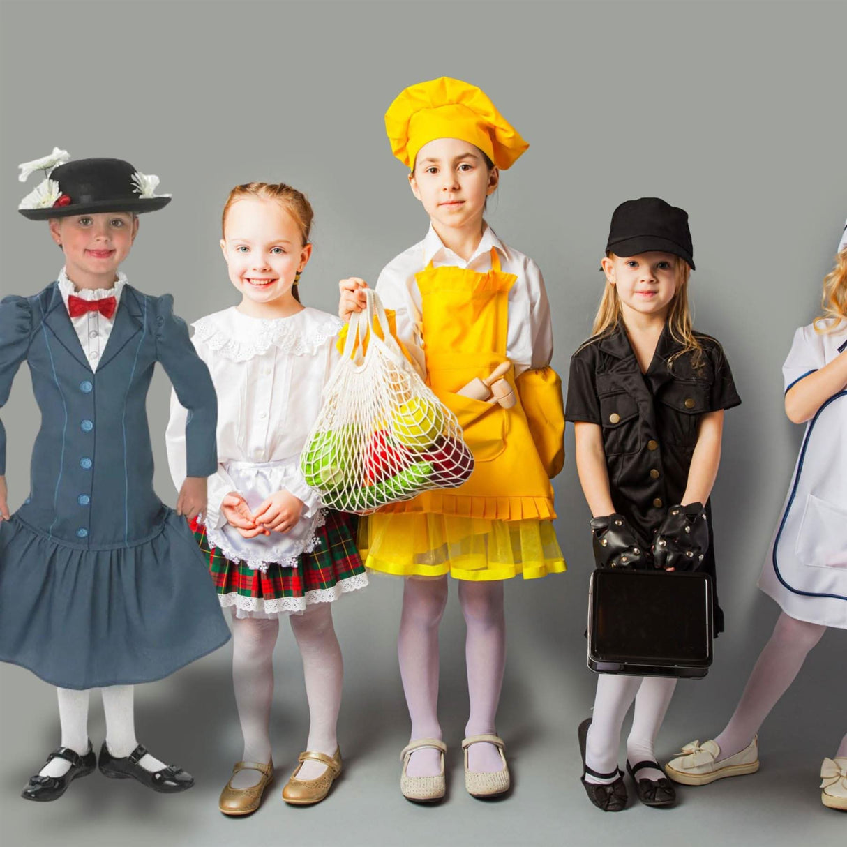 Kids dressed in costumes including a Mary Poppins costume for kids by Fancy Dress with hat and blue dress