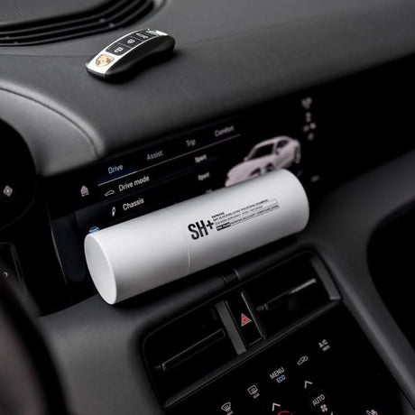 Patrick's thickening shampoo in white bottle displayed inside car dashboard from CLICKK Home Store