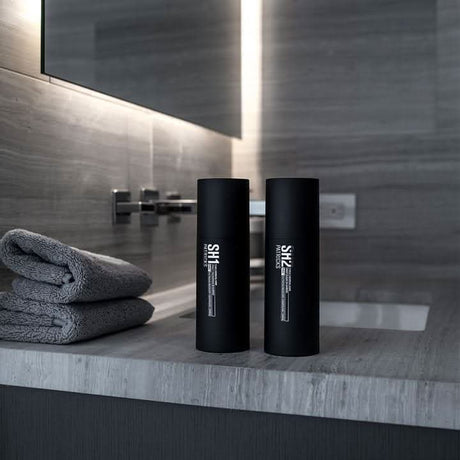 CLICKK Home Store Patricks SH2 shampoo deep clean black bottles on bathroom countertop with gray towels