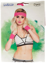 Pink sweatband set for sports including headband and wristbands worn by a woman