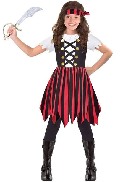 Girl wearing pirate costume for kids with red and black striped dress, headband, and toy sword