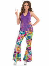 Woman wearing purple fringed hippie top XXL with colorful 70s style bell bottom pants and peace sign gesture