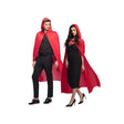 Man and woman wearing matching red hooded cape for adults over black outfits in stylish pose