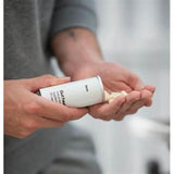 Person holding and pouring gut health capsules from container showing gut health capsule deals