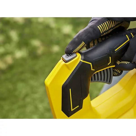 Close-up of hand pressing button on Stanley Fatmax 18V cordless blower with black and yellow design