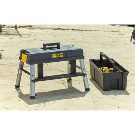 Stanley FatMax tool box with sturdy carrying handle and detachable black storage bin on a concrete surface