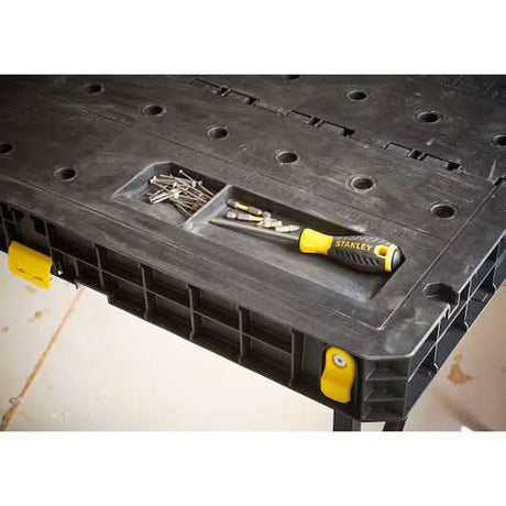 Black and Decker portable workbench for home use with tool compartment and Stanley screwdriver