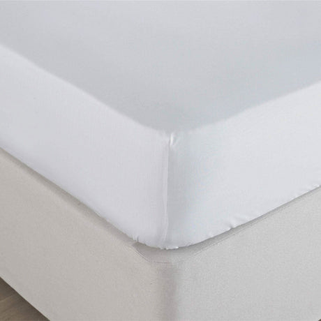 White super king fitted sheet white neatly covering mattress corner with smooth fabric texture