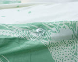 CLICCK Home Store superking reversible duvet cover with green and white botanical print and clear button detail