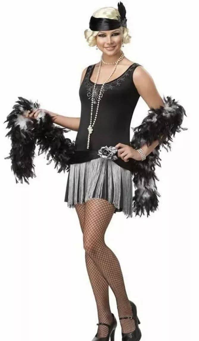 Teen flapper costume 1920s with black and silver dress, feather boa, fishnet stockings, and headband