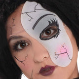 Close-up of a teen wearing a teen shattered doll Halloween costume with cracked face paint and dark lipstick
