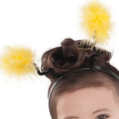 Yellow fuzzy antenna headband for toddler bee costume on dark hair of young child