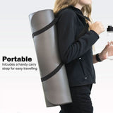 Person carrying a rolled gray non slip yoga mat for home workouts with a black adjustable strap