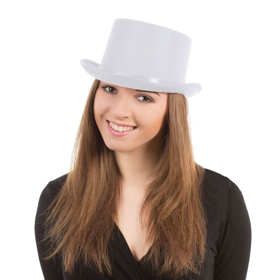 Smiling woman wearing a white top hat for costume with long brown hair and black outfit
