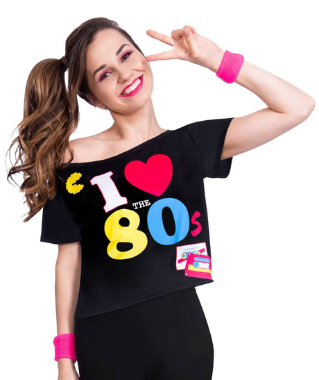 Woman wearing a black women's 80s t-shirt with colorful 80s graphics and pink wristbands