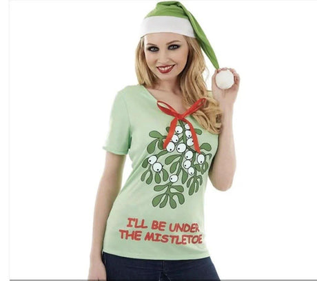 Women's Christmas slogan t-shirt in light green with mistletoe graphic and red text I'll be under the mistletoe
