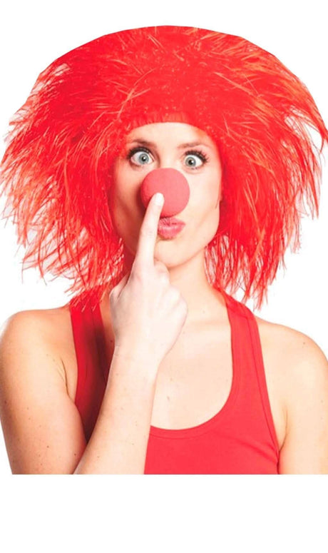 Woman wearing a bright red women's killer clown wig and red nose holding finger to her nose